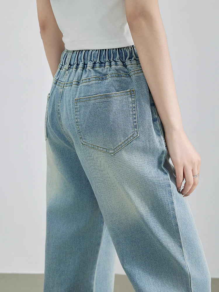 Calça Jeans Feminina Azul Descolorida Perna Larga com Cós Alto Elástico e Cordão