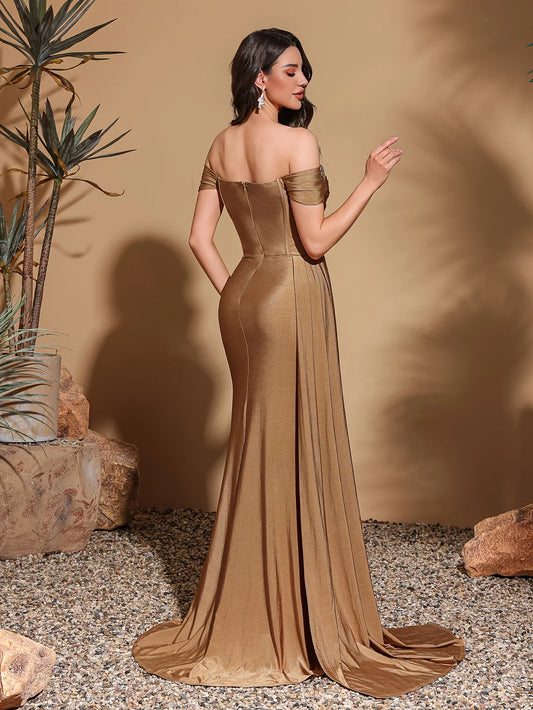 One-shoulder dress with rhinestone embellishments, side flaps and slits