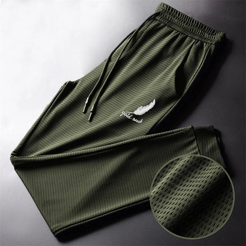 Men's Hollow Out Ice Silk Pants Mesh Breathable Casual Thin Quick Dry Pant Loose Elastic Beam Feet Pants Sports Fitness Trousers