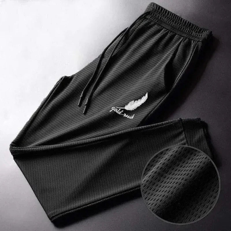 Men's Hollow Out Ice Silk Pants Mesh Breathable Casual Thin Quick Dry Pant Loose Elastic Beam Feet Pants Sports Fitness Trousers