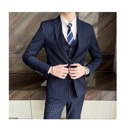 New three-piece suit with tailored striped business suit blazer and trousers set. Korean fashion trend. Stylish wedding attire.