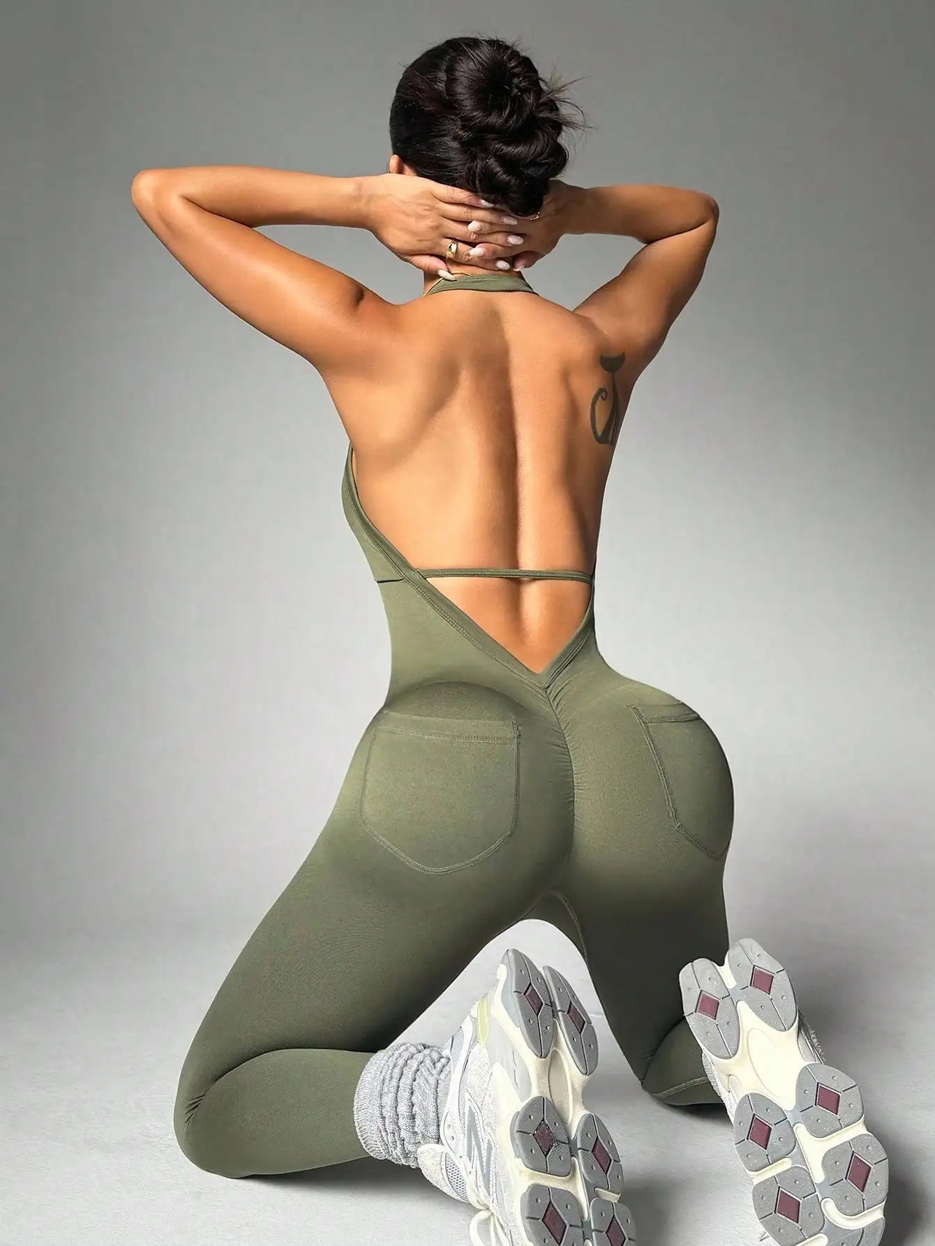 Women's solid color vest style seamless elastic sports jumpsuit with pocket design