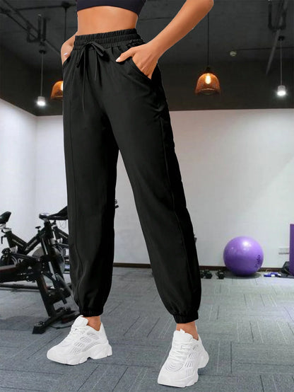 Loose running and fitness pants, women's side pockets, outdoor casual sports pants, ankle tied yoga pants