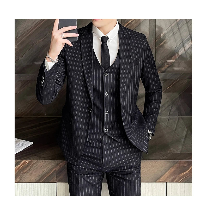 New three-piece suit with tailored striped business suit blazer and trousers set. Korean fashion trend. Stylish wedding attire.