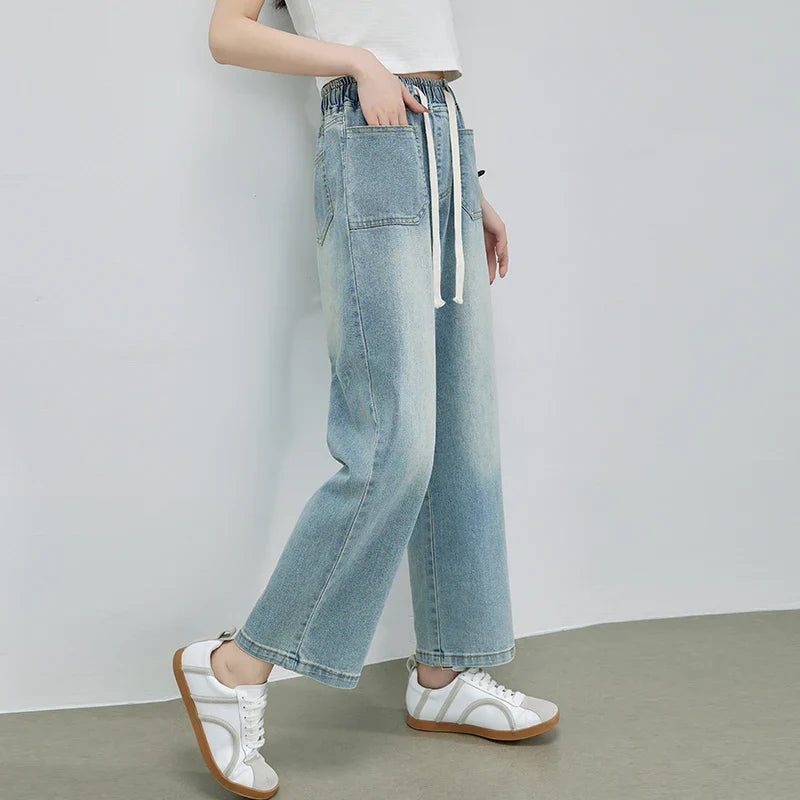 Calça Jeans Feminina Azul Descolorida Perna Larga com Cós Alto Elástico e Cordão