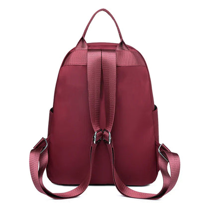 Men's and women's fashionable backpack made of nylon, suitable for travel, tourism and photography. It has multiple pockets.