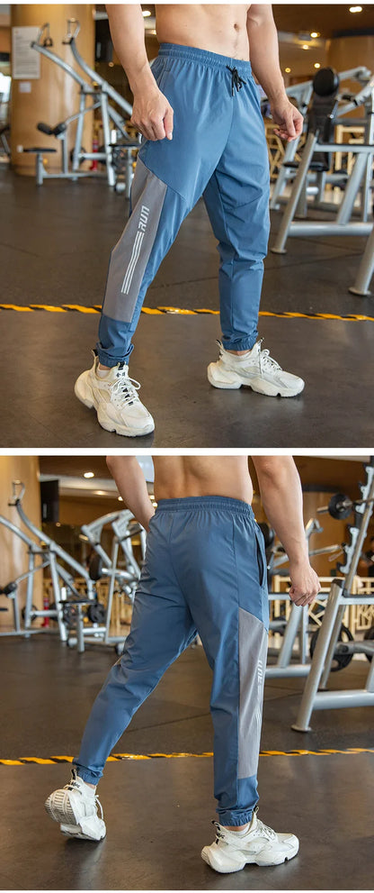 Mens Gym Fitness Running Sweatpants Workout Athletic Long Pants Outdoor Training Sports Trousers Elastic Waist Zipper Pockets