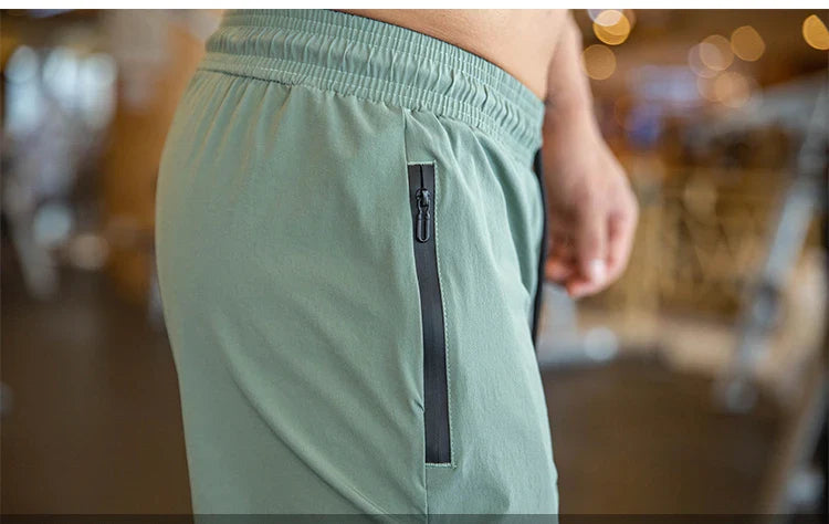 Mens Gym Fitness Running Sweatpants Workout Athletic Long Pants Outdoor Training Sports Trousers Elastic Waist Zipper Pockets