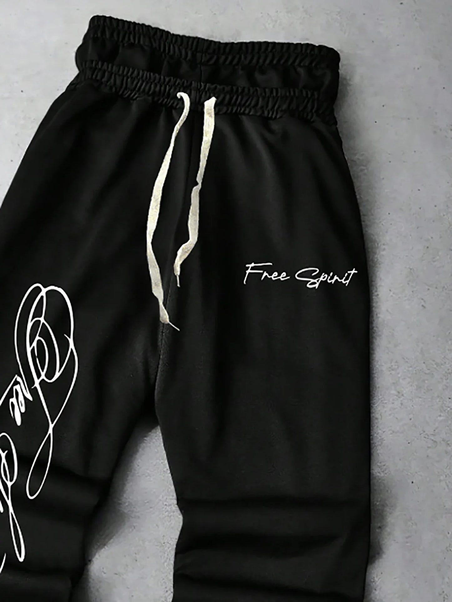 Men's Trendy Street-Style Ins High Street Black Faux Two-Piece Design Sweatpants with Unique Waistband and Ankle Zipper Details. It Is Perfect for Music Festival Outfits or Everyday Wear, Making It a Great Gift for Your Boyfr