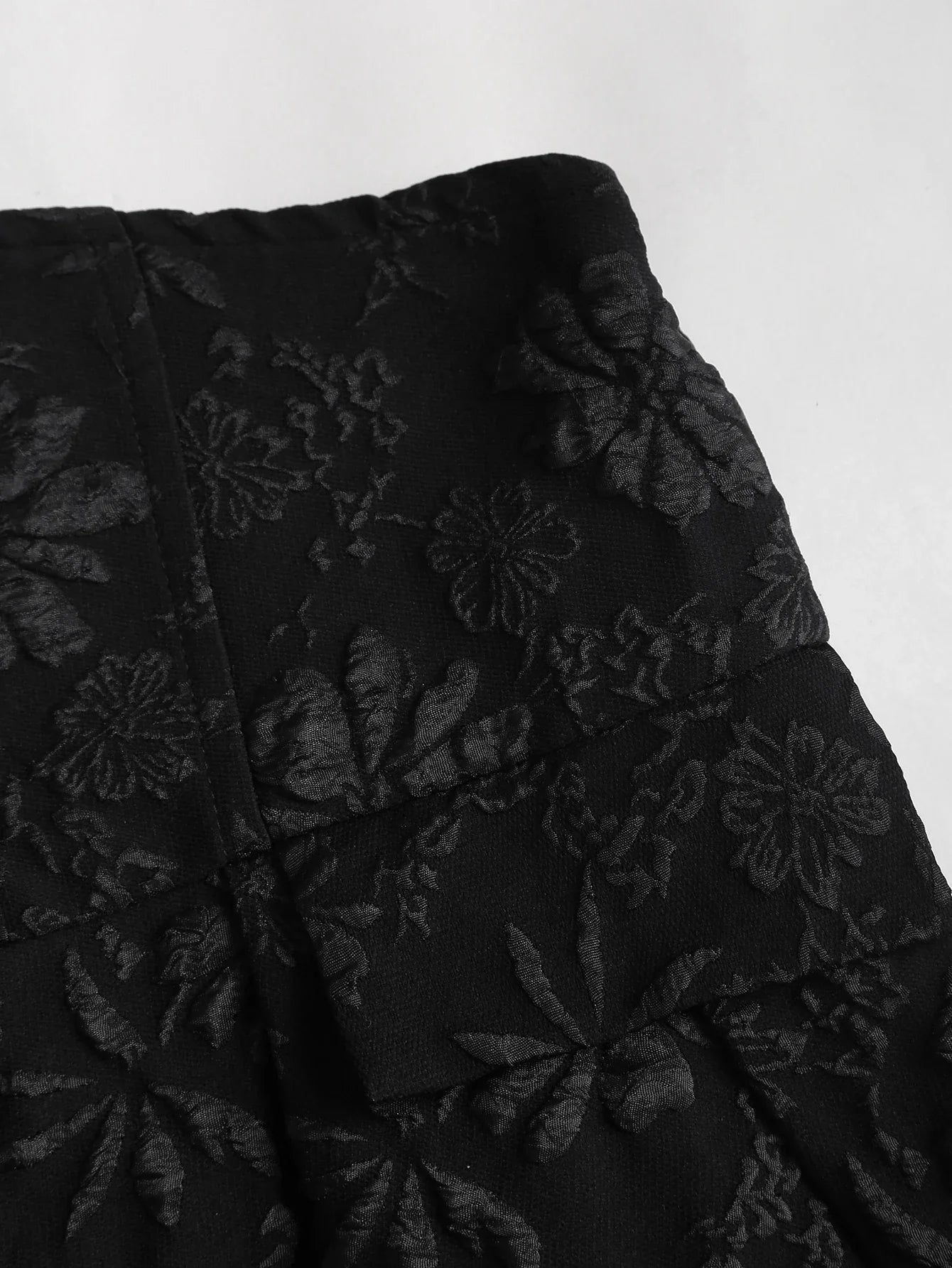 Black floral jacquard strapless dress with button embellishments and puff style skirt