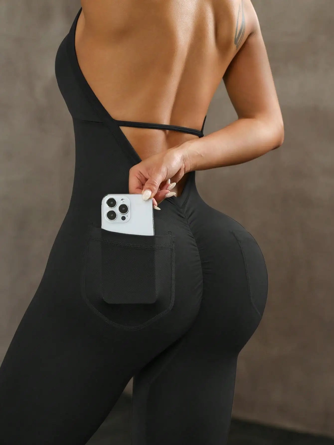 Women's solid color vest style seamless elastic sports jumpsuit with pocket design