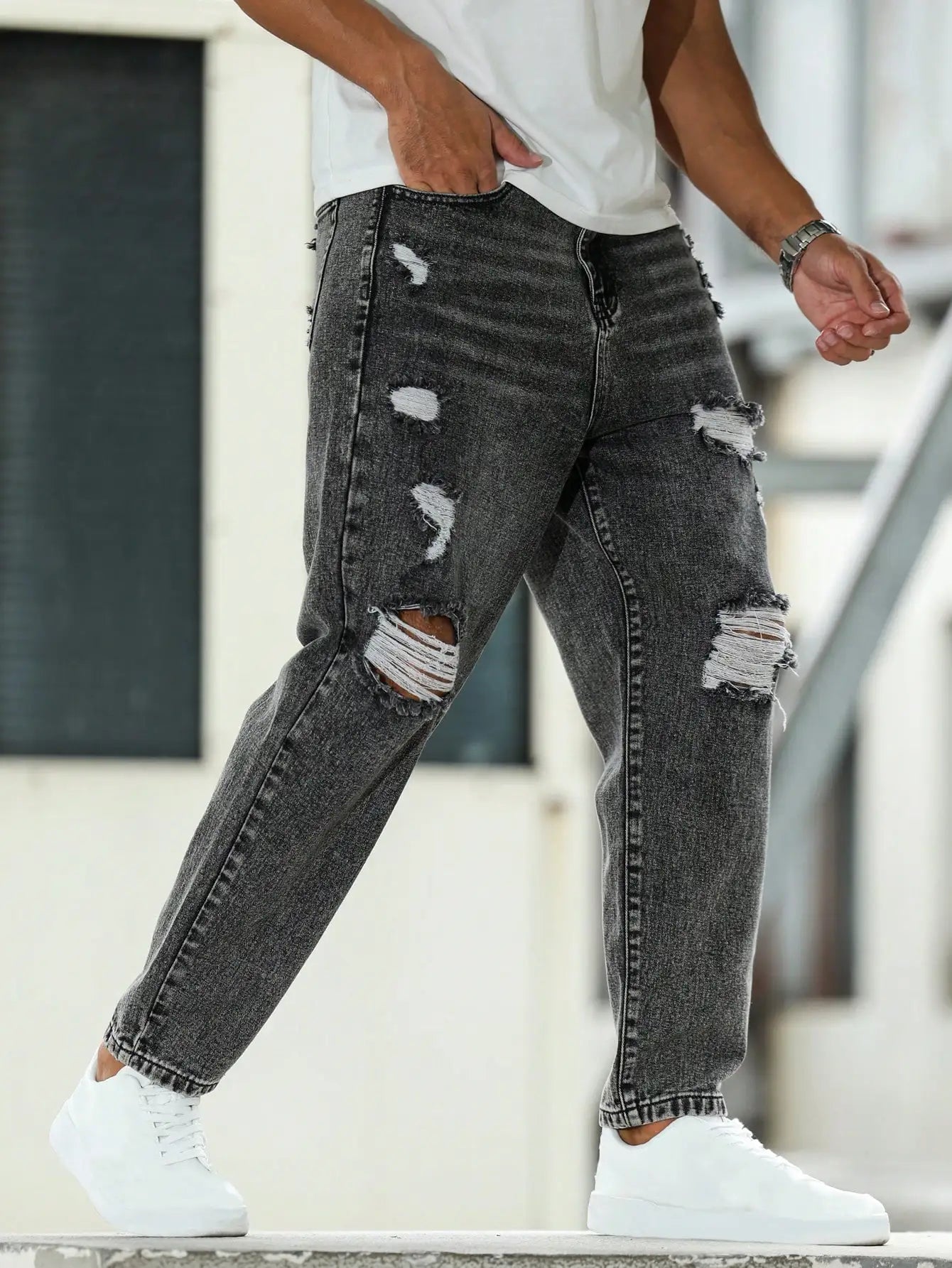 Men's ripped jeans for spring and autumn, dark gray harem pants. Street style. Casual trend.