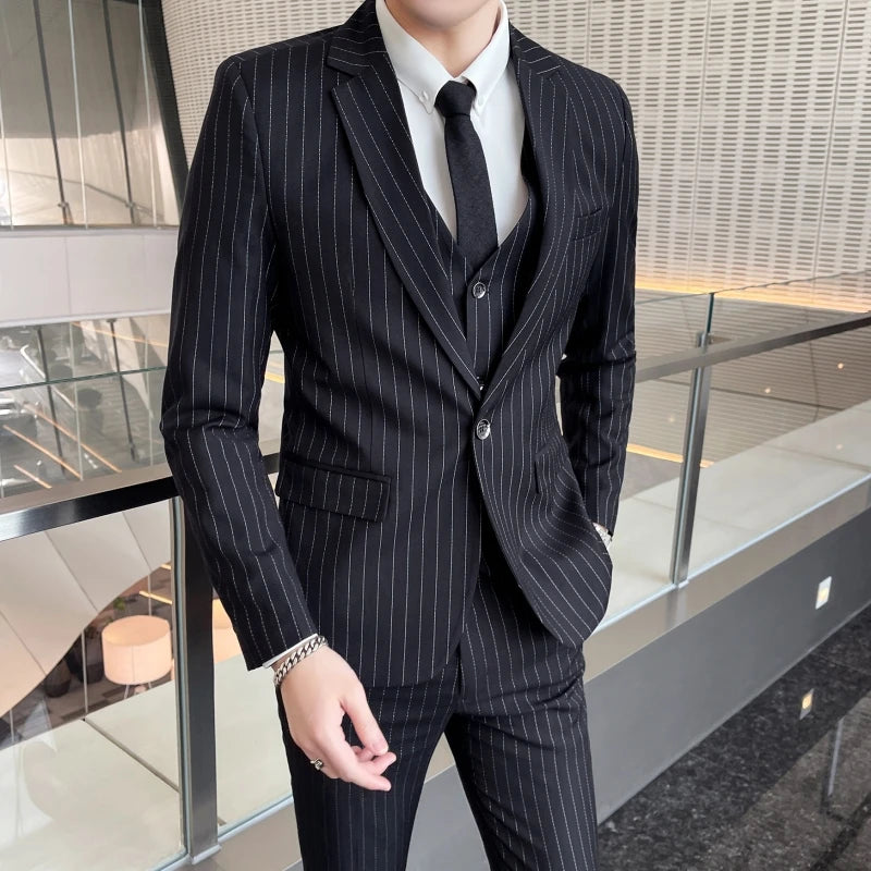 New three-piece suit with tailored striped business suit blazer and trousers set. Korean fashion trend. Stylish wedding attire.
