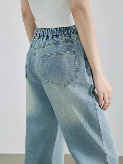 Calça Jeans Feminina Azul Descolorida Perna Larga com Cós Alto Elástico e Cordão