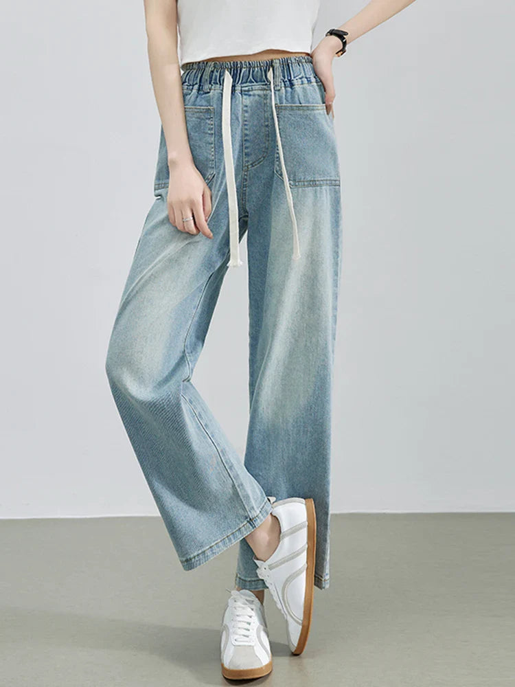 Calça Jeans Feminina Azul Descolorida Perna Larga com Cós Alto Elástico e Cordão