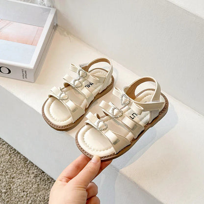 Girls Sandals New 2024 Summer Kids Fashion Bowknot Heart Princess Sandals Party Dress Shoes Children Soft Sole Beach Flats Shoe