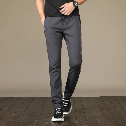 Summer men's ice silk quick drying pocket zipper casual pants slim fit Korean version ice silk sports pants straight tube quick