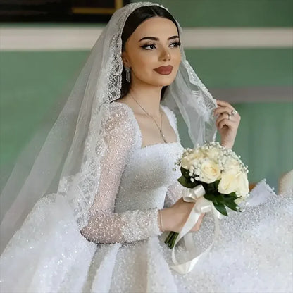 Customized Gorgeous Beaded Sequin Boat Neck Ball Gown Wedding Dresses 2025 Long Sleeves Court Train Tulle Bridal Gowns