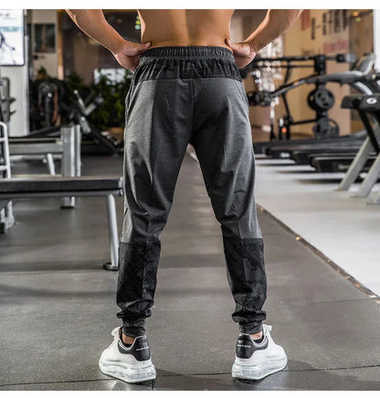 Mens Gym Fitness Running Sweatpants Workout Athletic Long Pants Outdoor Training Sports Trousers Elastic Waist Zipper Pockets