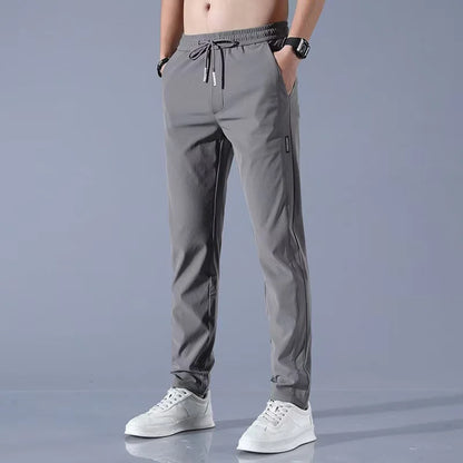 Summer men's ice silk quick drying pocket zipper casual pants slim fit Korean version ice silk sports pants straight tube quick