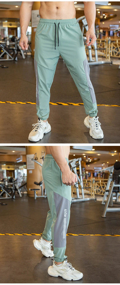 Mens Gym Fitness Running Sweatpants Workout Athletic Long Pants Outdoor Training Sports Trousers Elastic Waist Zipper Pockets