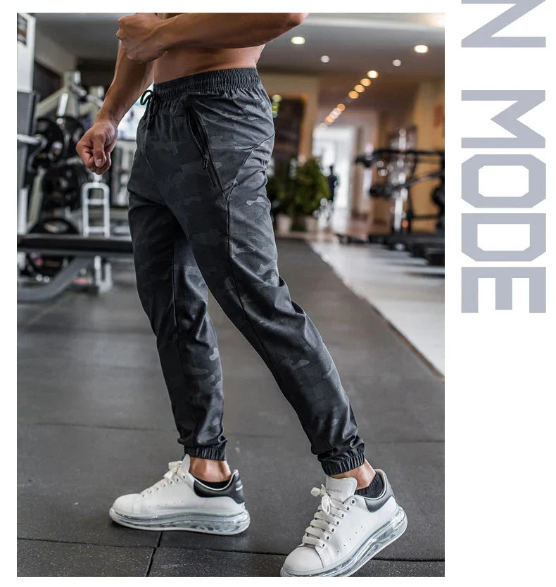 Mens Gym Fitness Running Sweatpants Workout Athletic Long Pants Outdoor Training Sports Trousers Elastic Waist Zipper Pockets