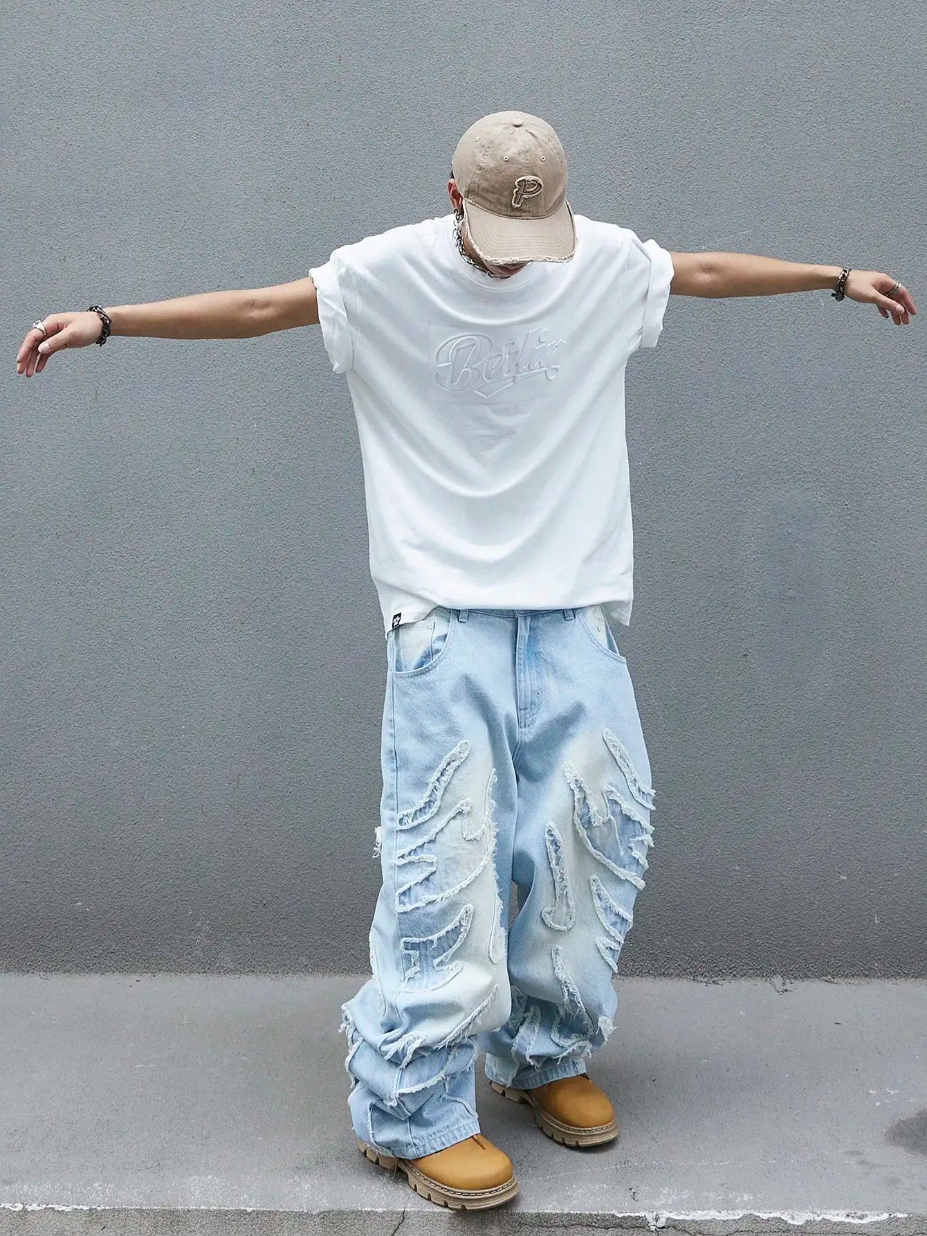 Men's trendy and cool denim wide-leg pants for all seasons featuring unique patchwork patterns, light blue street-stunning style