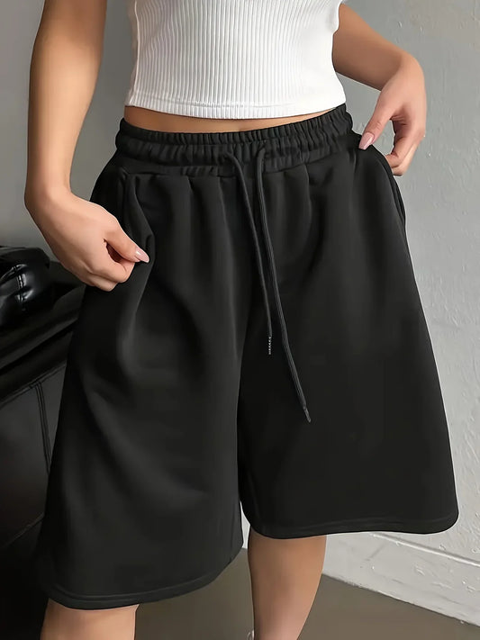 Plus-size women's casual style solid color sweatshirt and shorts with drawstring waist and pockets for everyday casual wear.