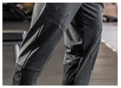 Mens Gym Fitness Running Sweatpants Workout Athletic Long Pants Outdoor Training Sports Trousers Elastic Waist Zipper Pockets