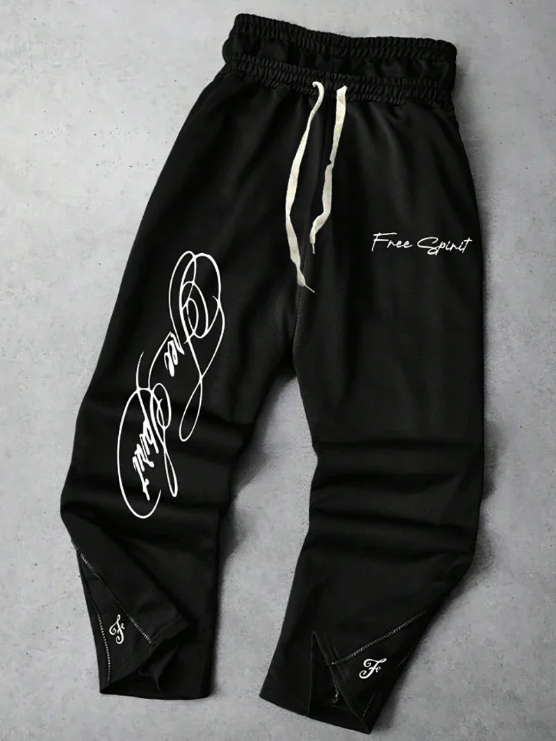 Men's Trendy Street-Style Ins High Street Black Faux Two-Piece Design Sweatpants with Unique Waistband and Ankle Zipper Details. It Is Perfect for Music Festival Outfits or Everyday Wear, Making It a Great Gift for Your Boyfr