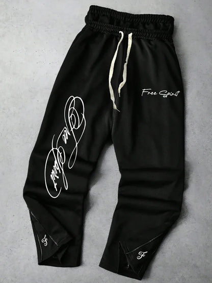 Men's Trendy Street-Style Ins High Street Black Faux Two-Piece Design Sweatpants with Unique Waistband and Ankle Zipper Details. It Is Perfect for Music Festival Outfits or Everyday Wear, Making It a Great Gift for Your Boyfr