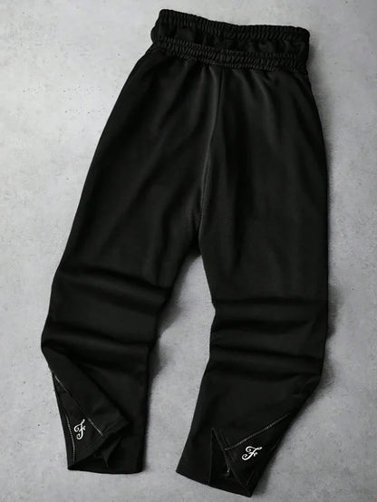 Men's Trendy Street-Style Ins High Street Black Faux Two-Piece Design Sweatpants with Unique Waistband and Ankle Zipper Details. It Is Perfect for Music Festival Outfits or Everyday Wear, Making It a Great Gift for Your Boyfr
