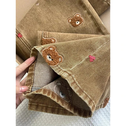 Calça Jeans Feminina Perna Larga Cintura Alta 2025 Nova Coleção Primavera com Renda e Ursinho Bordado Patchwork Caimento Justo e Confortável para o Dia a Dia