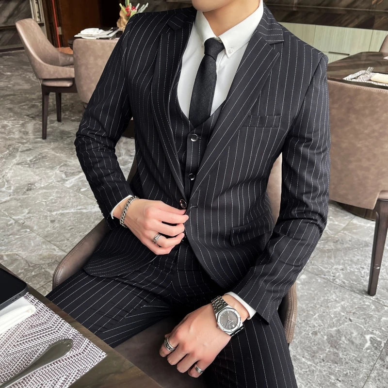 New three-piece suit with tailored striped business suit blazer and trousers set. Korean fashion trend. Stylish wedding attire.