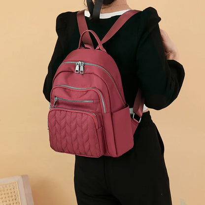 Men's and women's fashionable backpack made of nylon, suitable for travel, tourism and photography. It has multiple pockets.