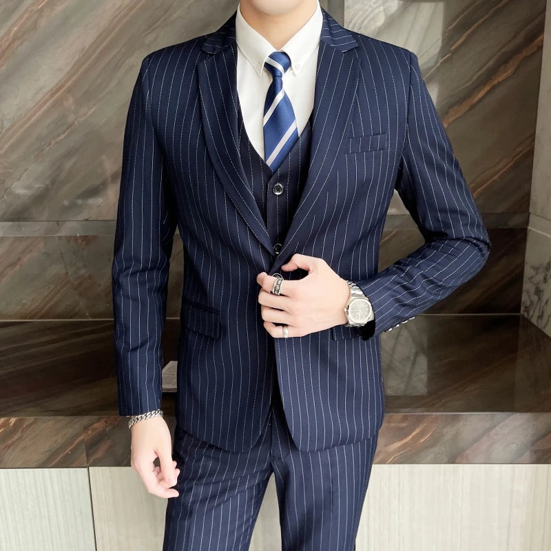 New three-piece suit with tailored striped business suit blazer and trousers set. Korean fashion trend. Stylish wedding attire.