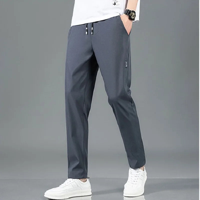Men's Summer Ice Silk Pants Mesh Breathable Casual Thin Quick Dry Pants Loose Elastic Beam Feet Pants Sports Fitness Trousers