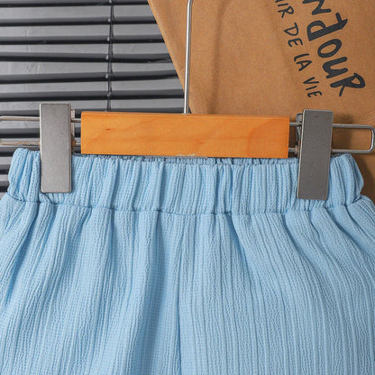 New summer men's short-sleeved woven pure blue button pocket + loose shorts two-piece set