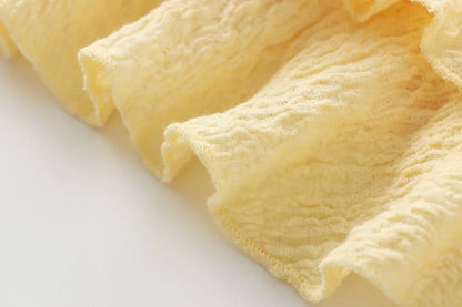 Textured halter crop top with ruffles Women's short yellow sleeveless top with sexy streamers for summer 2025 ETJ