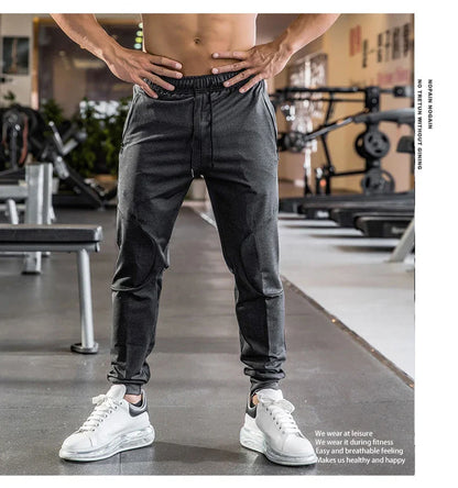 Mens Gym Fitness Running Sweatpants Workout Athletic Long Pants Outdoor Training Sports Trousers Elastic Waist Zipper Pockets