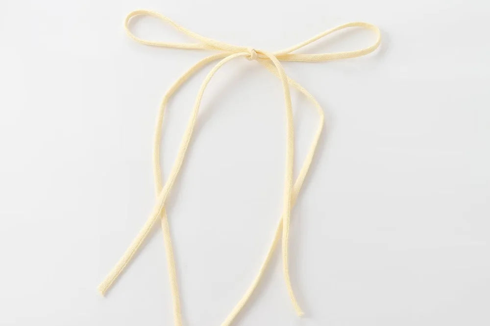 Textured halter crop top with ruffles Women's short yellow sleeveless top with sexy streamers for summer 2025 ETJ