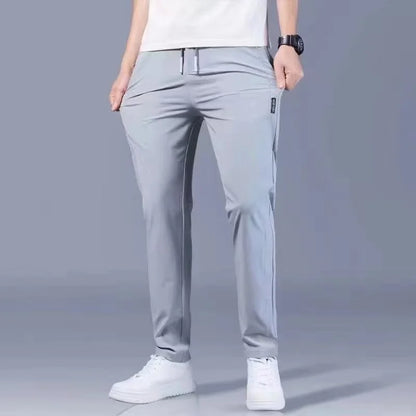 Summer men's ice silk quick drying pocket zipper casual pants slim fit Korean version ice silk sports pants straight tube quick
