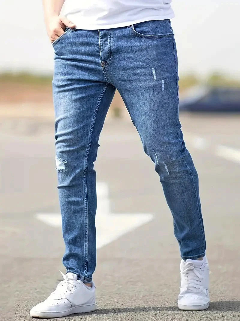 Calça Jeans Masculina Skinny Destroyed Primavera 2026 Lavagem Vintage Elástica Biker com Buracos Casual Ajuste Justo Streetwear Jeans Lápis Jogger