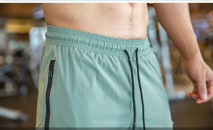 Mens Gym Fitness Running Sweatpants Workout Athletic Long Pants Outdoor Training Sports Trousers Elastic Waist Zipper Pockets