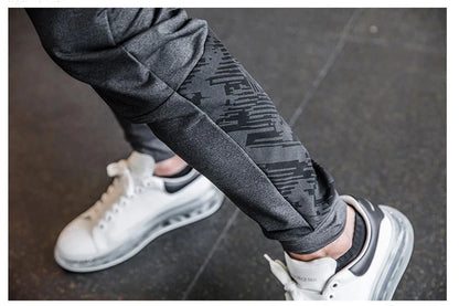 Mens Gym Fitness Running Sweatpants Workout Athletic Long Pants Outdoor Training Sports Trousers Elastic Waist Zipper Pockets