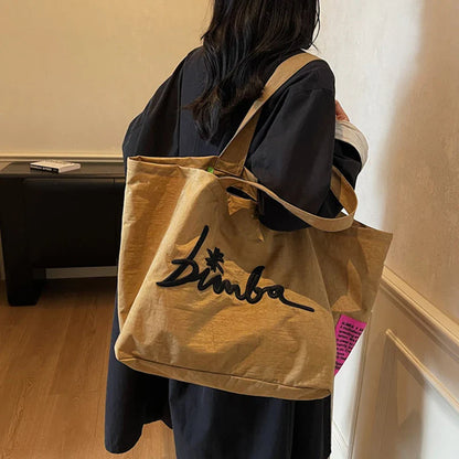 Fashionable and simple large capacity popular solid color handbag, personalized and multifunctional casual letter embroidered sh