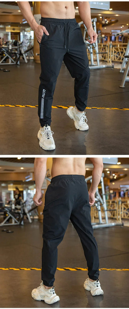 Mens Gym Fitness Running Sweatpants Workout Athletic Long Pants Outdoor Training Sports Trousers Elastic Waist Zipper Pockets