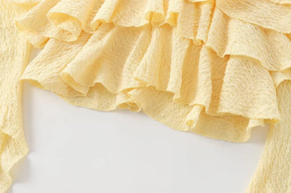 Textured halter crop top with ruffles Women's short yellow sleeveless top with sexy streamers for summer 2025 ETJ