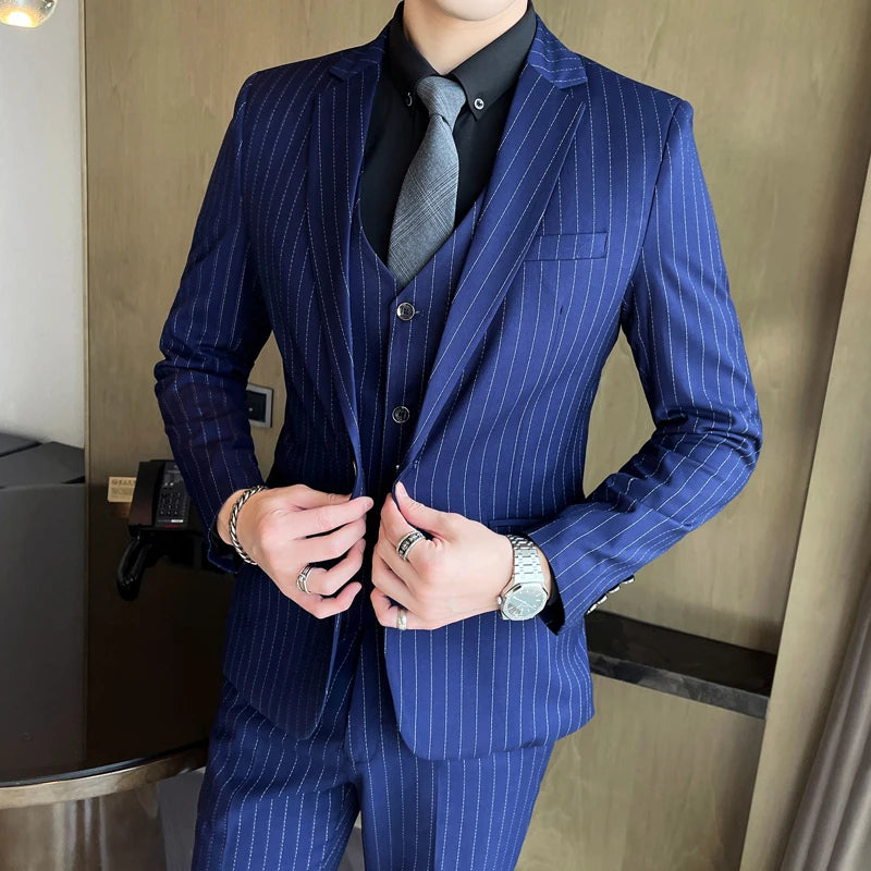 New three-piece suit with tailored striped business suit blazer and trousers set. Korean fashion trend. Stylish wedding attire.