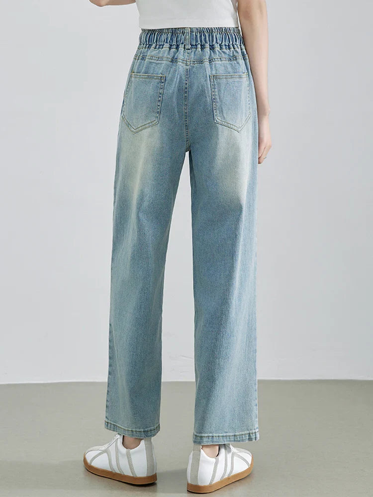 Calça Jeans Feminina Azul Descolorida Perna Larga com Cós Alto Elástico e Cordão